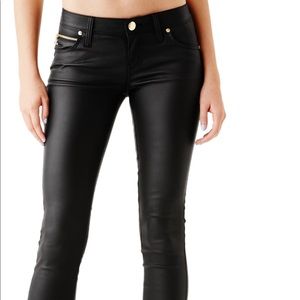 Pleather guess jeans with gold detail.